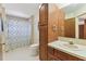 Bathroom with a shower/tub combination, cabinet, and single sink vanity at 10265 130Th St, Largo, FL 33774
