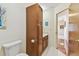 Bathroom with a cabinet, sink, and a view to other rooms at 10265 130Th St, Largo, FL 33774
