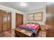 Bedroom with hardwood floors, large closet, and natural light at 10265 130Th St, Largo, FL 33774