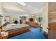 Bright, expansive bedroom boasts a large bed, natural light, and functional built-in storage at 10265 130Th St, Largo, FL 33774