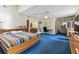 Bright, expansive bedroom boasts a large bed, natural light, and functional built-in storage at 10265 130Th St, Largo, FL 33774