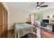 Bedroom with hardwood floors, ceiling fan, and natural light from a window at 10265 130Th St, Largo, FL 33774