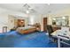 Bright, expansive bedroom boasts a large bed, natural light, and functional built-in storage at 10265 130Th St, Largo, FL 33774