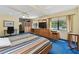 Bright, expansive bedroom boasts a large bed, natural light, and functional built-in storage at 10265 130Th St, Largo, FL 33774
