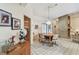 Cozy dining area featuring a brick accent wall, wooden table, and tile flooring, ideal for gatherings at 10265 130Th St, Largo, FL 33774