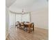 Elegant dining room with large windows, wood floors, and chandelier at 10265 130Th St, Largo, FL 33774