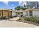 Close up of the front entry with lush landscaping and a curved entryway at 10265 130Th St, Largo, FL 33774
