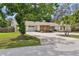 Well-maintained one-story home with a two-car garage, and charming landscaping at 10265 130Th St, Largo, FL 33774