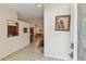 Spacious foyer with tile flooring, artwork, and view into the dining area at 10265 130Th St, Largo, FL 33774