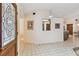 Bright foyer with tile flooring, glass door, and view of the interior layout at 10265 130Th St, Largo, FL 33774