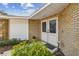 Charming entrance with brick facade, double doors, and manicured landscaping creating curb appeal at 10265 130Th St, Largo, FL 33774