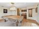 Game room showcasing a pool table, overhead lighting, and vintage decor at 10265 130Th St, Largo, FL 33774