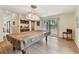 Game room with pool table, overhead light fixture, and a view to the outside at 10265 130Th St, Largo, FL 33774