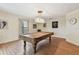 Spacious game room features a pool table and a unique vintage light fixture at 10265 130Th St, Largo, FL 33774