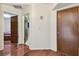 Hallway with wood floors and access to bedrooms and bathrooms at 10265 130Th St, Largo, FL 33774