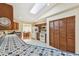 Functional kitchen area with wood cabinets, blue tiled countertops, and stainless-steel appliances for a modern touch at 10265 130Th St, Largo, FL 33774