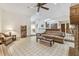 Bright living room with tile floors, brick fireplace, and views of other spaces in the home at 10265 130Th St, Largo, FL 33774