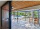 Screened-in patio with tile flooring and a view of the backyard pool area at 10265 130Th St, Largo, FL 33774