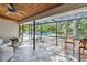 Covered patio with a ceiling fan, tile floor and furniture overlooking the pool at 10265 130Th St, Largo, FL 33774
