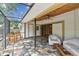 Covered patio features ceiling fan, tile flooring, and opens to the backyard area at 10265 130Th St, Largo, FL 33774
