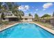Backyard pool area with a clear view of the water, surrounding patio and fenced yard at 10265 130Th St, Largo, FL 33774