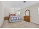 Neutral bedroom featuring a classic bed frame, side tables, and soft carpeting at 11001 Ridgedale Rd, Temple Terrace, FL 33617