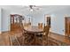 Cozy dining room showcasing a round wooden table, antique china cabinet, and decorative rug at 11001 Ridgedale Rd, Temple Terrace, FL 33617