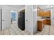 Kitchen with appliances, tile floors, and ample storage space at 11001 Ridgedale Rd, Temple Terrace, FL 33617