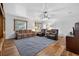 Spacious living room featuring hardwood floors, large rug, and comfortable furnishings at 11001 Ridgedale Rd, Temple Terrace, FL 33617