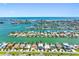 Aerial view of waterfront home with Gulf views, surrounded by canals and lush landscaping at 11260 7Th E St, Treasure Island, FL 33706