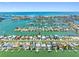 Beautiful aerial view of waterfront homes and docks in coastal community near the beach at 11260 7Th E St, Treasure Island, FL 33706