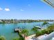 Scenic waterfront view of neighborhood homes, boat docks, and clear blue skies at 11260 7Th E St, Treasure Island, FL 33706