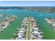 Striking aerial view of a waterfront community showcasing luxury homes and stunning waterways at 11260 7Th E St, Treasure Island, FL 33706