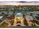 Breathtaking aerial view showcases a luxury waterfront property, lush landscaping, and surrounding coastal community at 11260 7Th E St, Treasure Island, FL 33706