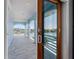 Waterfront balcony features tile floors, arches, and expansive views of the bay at 11260 7Th E St, Treasure Island, FL 33706