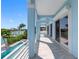 Long covered balcony offering a view of the pool, boat dock and the inter-coastal waterway at 11260 7Th E St, Treasure Island, FL 33706