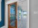 Spacious covered balcony offering views of the water, featuring columns and tile flooring at 11260 7Th E St, Treasure Island, FL 33706