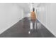 Finished basement with polished concrete floors, white walls, and a staircase at 11260 7Th E St, Treasure Island, FL 33706