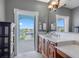 Bathroom vanity features a quartz countertop and a lovely waterfront view at 11260 7Th E St, Treasure Island, FL 33706
