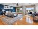 Spacious main bedroom with hardwood floors, fan, and beautiful water views from large windows at 11260 7Th E St, Treasure Island, FL 33706