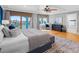 Large main bedroom with water views, hardwood floors, and a sitting area near the sliding glass doors at 11260 7Th E St, Treasure Island, FL 33706