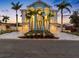 Striking two-story home with multiple garages, palm trees, and lush landscaping at 11260 7Th E St, Treasure Island, FL 33706