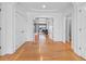 Bright foyer with hardwood floors, white trim, and views into adjacent living areas with lots of natural light at 11260 7Th E St, Treasure Island, FL 33706