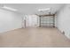 Large garage with a coated floor and garage door providing secure parking at 11260 7Th E St, Treasure Island, FL 33706