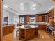 Expansive kitchen with custom cabinetry, stainless steel appliances, granite countertops, and a central island at 11260 7Th E St, Treasure Island, FL 33706