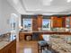 Gourmet kitchen with custom cabinets, wine cooler, granite countertops, and stainless steel appliances at 11260 7Th E St, Treasure Island, FL 33706