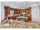 Spacious kitchen with custom cabinets, granite countertops, stainless appliances, and a large center island at 11260 7Th E St, Treasure Island, FL 33706