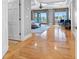 Stylish entry hall to a living room with hardwood floors, area rug, and views of the waterfront at 11260 7Th E St, Treasure Island, FL 33706