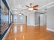 Spacious main bedroom features hardwood floors, ceiling fans, tray ceiling, and many windows at 11260 7Th E St, Treasure Island, FL 33706