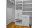 Walk-in closet features custom shelving, drawers, and hanging racks at 11260 7Th E St, Treasure Island, FL 33706